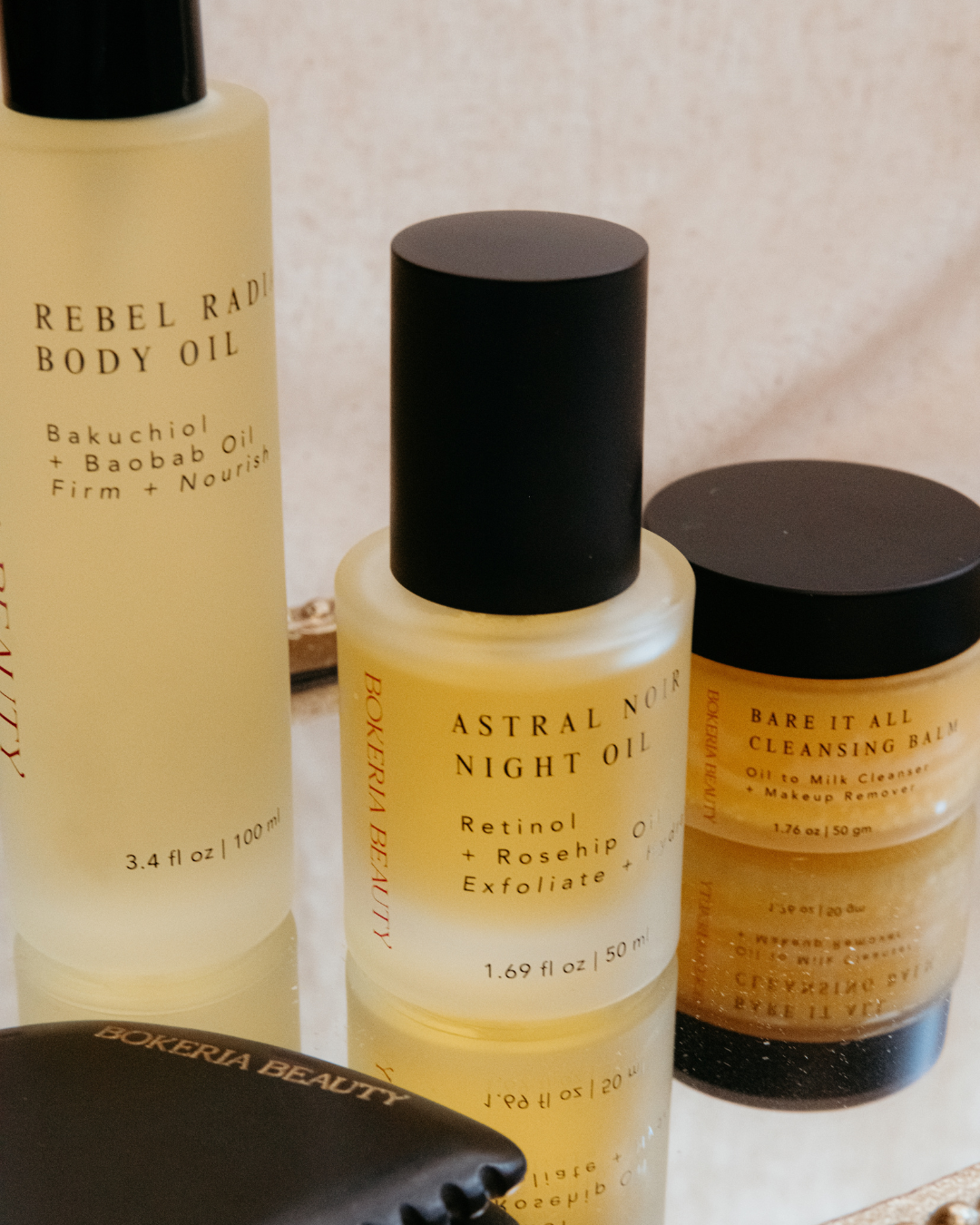 Three skincare products from Bokeria Beauty on a neutral background